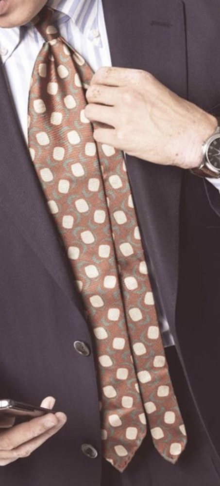 このようなネクタイの結び方はどんな感じですか？あと、ネクタイの種類や素材なども教えてほしいです。