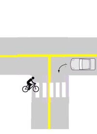 自転車 車道 青信号 左折車クラクション