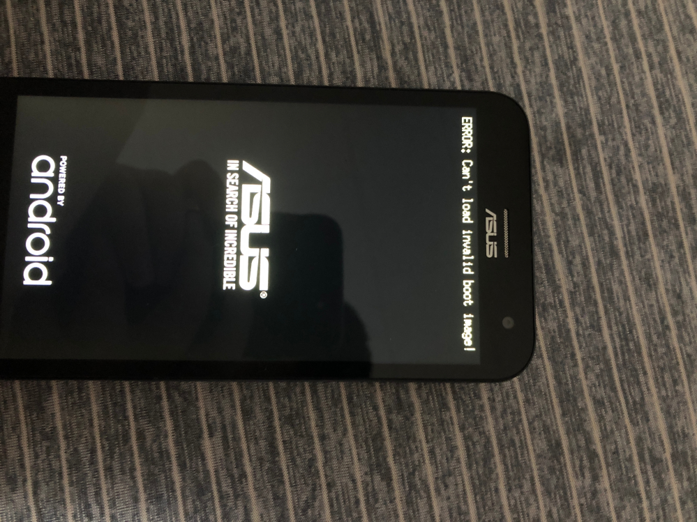 機種不明 ASUS Zenfone(Zenfone2 Laser？ ）について質問です。久しぶりにZenfoneを起動させようと、バッテリーを突っ込み、起動させたら下の画像のように出て、動かなくなりました。データのファクトリーリセットも実施しましたが、一切動きません。修理方法を教えてください。（自力で可能です）