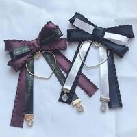 この画像のリボンの垂れてる部分 の先端 についている金具の名称がわかる方がい Yahoo 知恵袋